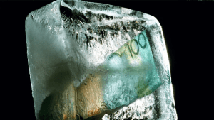 frozen funds depicted by an Australian $100 note frozen in a block of ice