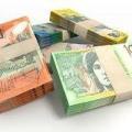 bundles of Australian currency of different denominations to provide buy-sell agreement cover