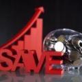 investment success reflected in image of piggy bank with the word SAVE and a chart showing growth in value