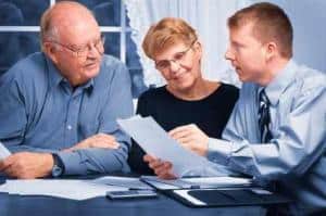 Retired Couple with adviser receiving information about their term allocated pension