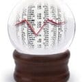 crystal ball reflecting a table of asset prices and a graph indicating a market outlook perception