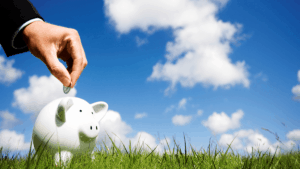 savings from surplus cashflow being placed into a piggy bank for investment later