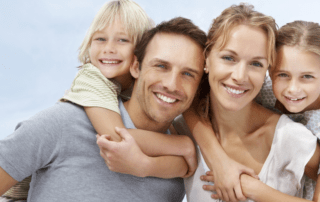 financial risk management important to young family of father mother and two daughters al smiling